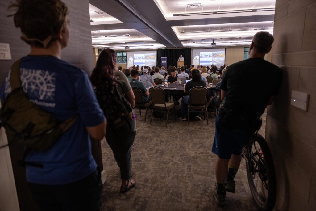 Attendees listen to Jordan Smith's keynote speech intently. (Photo credit: OpenStreetMap US)