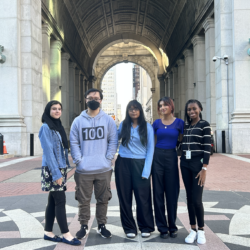 Civic Innovation Fellows stand together outside of 1 Centre Street.