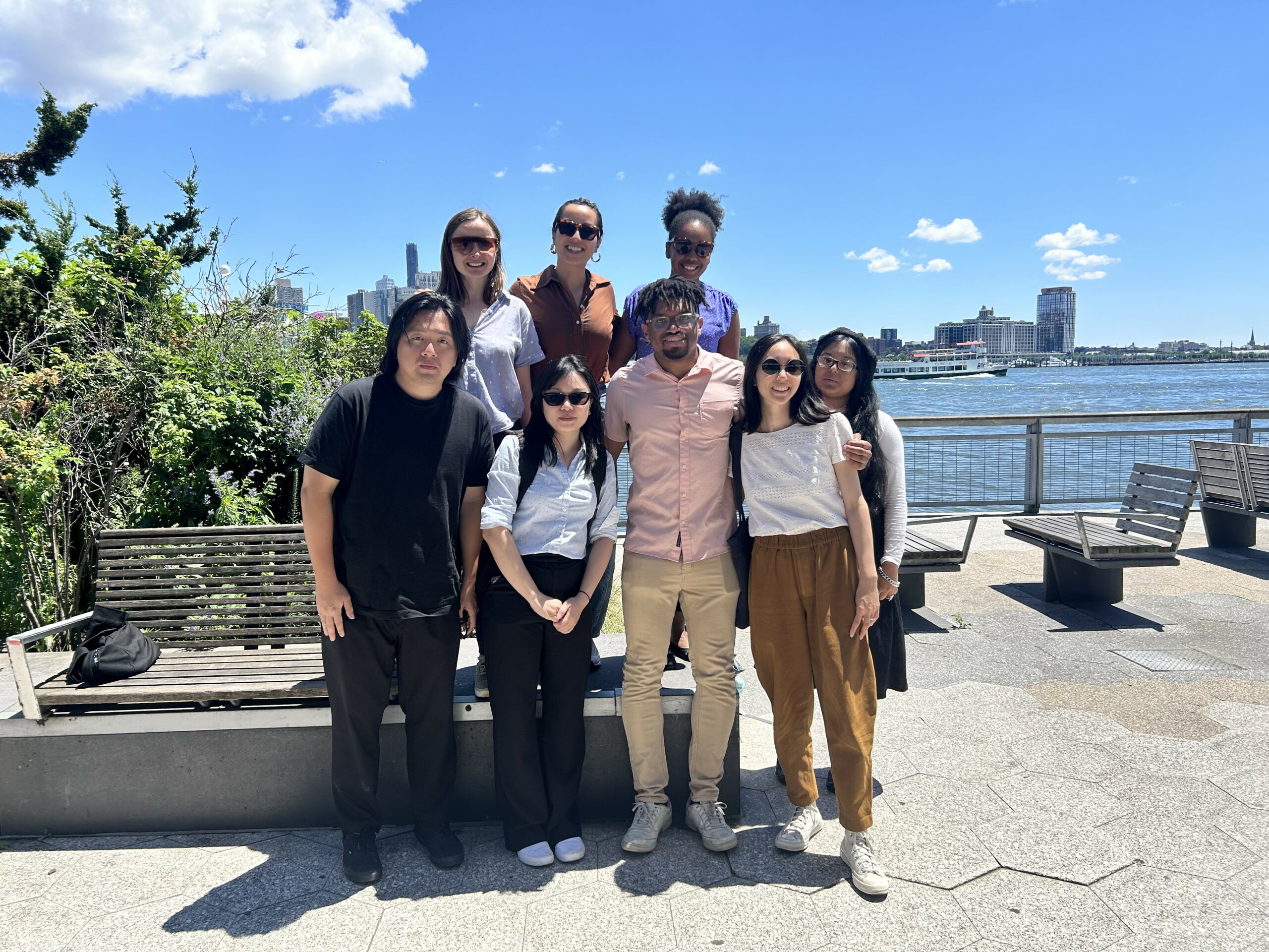 A group of BetaNYC team members pose together along the South Street Seaport.