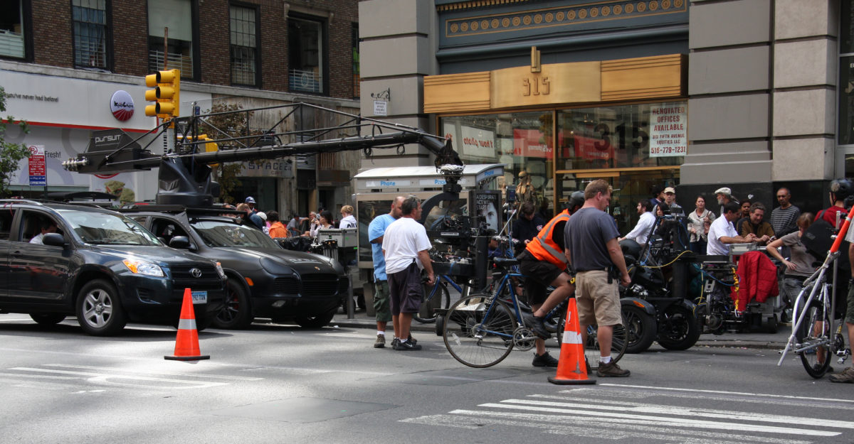 Film crew prepares to shoot a scene for the movie Premium Rush at the intersection of 5th Avenue and West 34th Street (beneath the Empire State Building), Manhattan, New York