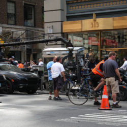 Film crew prepares to shoot a scene for the movie Premium Rush at the intersection of 5th Avenue and West 34th Street (beneath the Empire State Building), Manhattan, New York
